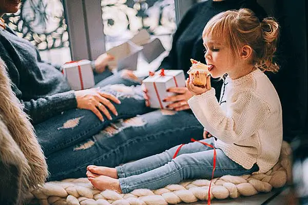 a child getting a gift on christmas
