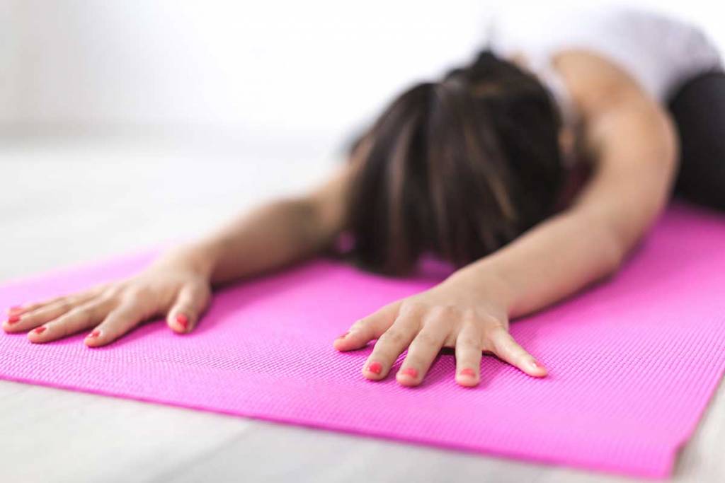 woman doing yoga in her brantford home