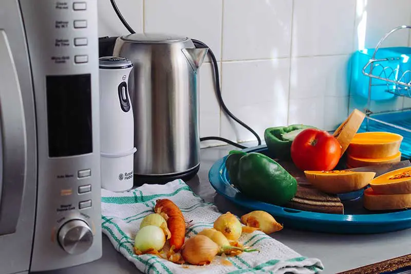 Boxing up kitchen clutter to donate or sell